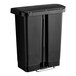 A black Rubbermaid Slim Jim rectangular front step-on trash can with a lid.