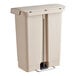 A beige Rubbermaid Slim Jim wastebasket with a lid and metal step-on pedal.