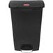 A black plastic Rubbermaid Slim Jim step-on trash can.