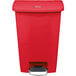 A red Rubbermaid Slim Jim step-on trash can.