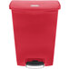 A red Rubbermaid Slim Jim step-on trash can.