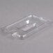 A clear plastic Carlisle container lid with a spoon notch.