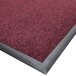A burgundy Cactus Mat Ultra-Berber carpet mat with a black border.