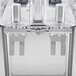 A white stainless steel Crathco beverage dispenser with two bowls.