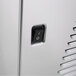 A close-up of a switch on a Crathco Mini Simplicity Bubbler Series beverage dispenser.