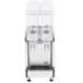 A Crathco refrigerated beverage dispenser with two clear containers on top.