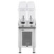 A Crathco refrigerated beverage dispenser with two clear containers and a silver lid.