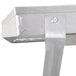 A close-up of a metal frame with a screw attached to it.