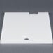 A white plastic board with a hole in it.