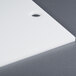 A white plastic Filler Plate for a VP330 Vacuum Packaging Machine with a hole in the middle.