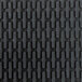 A close up of a black rubber Cactus Mat with a ridged surface.