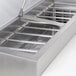 A stainless steel Avantco refrigeration pan divider bar.