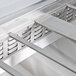 A close-up of a metal shelf divider bar.