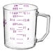 A clear polycarbonate measuring cup with purple measurements on the counter.