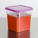 A purple polyethylene lid on a Cambro square food storage container.