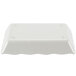 A white rectangular Thunder Group melamine tray with a white scalloped border.