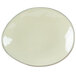 A white Tuxton ellipse china plate with a grey rim on a white surface.