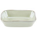 A white rectangular dish with a white rim.