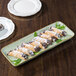 A TuxTrendz china tray with food on it.