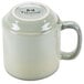 A Tuxton TuxTrendz Artisan Sagebrush mug with a white interior and handle.