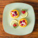 A Tuxton Artisan china pasta plate with lemon and raspberry desserts.