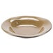 A beige china soup bowl with a brown and silver rim.