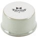A white Tuxton china ramekin with black text on the side.