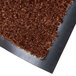 A close up of a chocolate brown Cactus Mat carpet with a black backing.