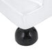 A white pedestal with a black base and a black patty press.