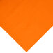A Sunkissed Orange plastic table cover with an orange square and white dots.