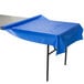 A Creative Converting cobalt blue plastic table cover on a table.