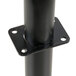 A black metal pipe with holes on the top.