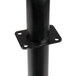 A black metal gas manifold with a white cap on a black pipe base.