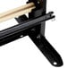 A black metal Bulman countertop paper cutter rack with a wooden stick.