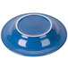 A blue bowl with a white rim.