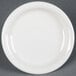 A white Fiesta® dinnerware appetizer plate with a rim on a grey surface.