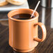 A GET Diamond Harvest Pumpkin Tritan mug with a straw in it.