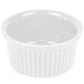 A white fluted ramekin with a white background.