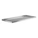 A silver rectangular stainless steel shelf for a Regency work table.