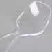A clear plastic Fineline serving spoon.