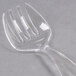A close-up of a clear plastic Fineline Serving Fork.