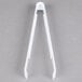 A pair of white plastic Fineline serving tongs.