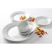 A Tuxton Pacifica bright white embossed china plate with pasta and a bowl.