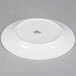 A Tuxton bright white china plate with an embossed design.
