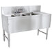 A stainless steel Advance Tabco underbar sink with 3 bowls and a drainboard, with a splash mount faucet.