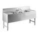 A stainless steel Advance Tabco underbar sink with 3 compartments, 2 drainboards, and a splash mount faucet.