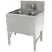 An Advance Tabco stainless steel underbar sink with two bowls and a deck mount faucet.