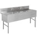 An Advance Tabco stainless steel underbar sink with 4 compartments, 2 drainboards and 2 splash mount faucets.