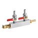 A Beverage-Air 2-way draft manifold with two brass valves with red handles and a silver and red valve.