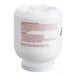 A large white container of Noble Acclaim concentrated solid dish machine detergent.